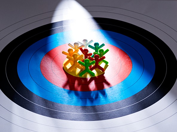 Figures on a bullesye, representing targeting an offer to a specific audience